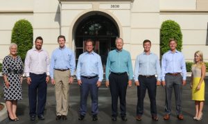 IPC Naples 8 Team members in front of their office building